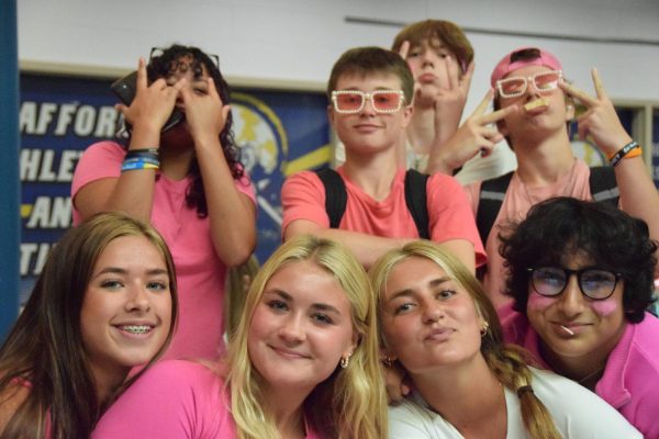 Students participate in Barbie Day as part of school spirit.