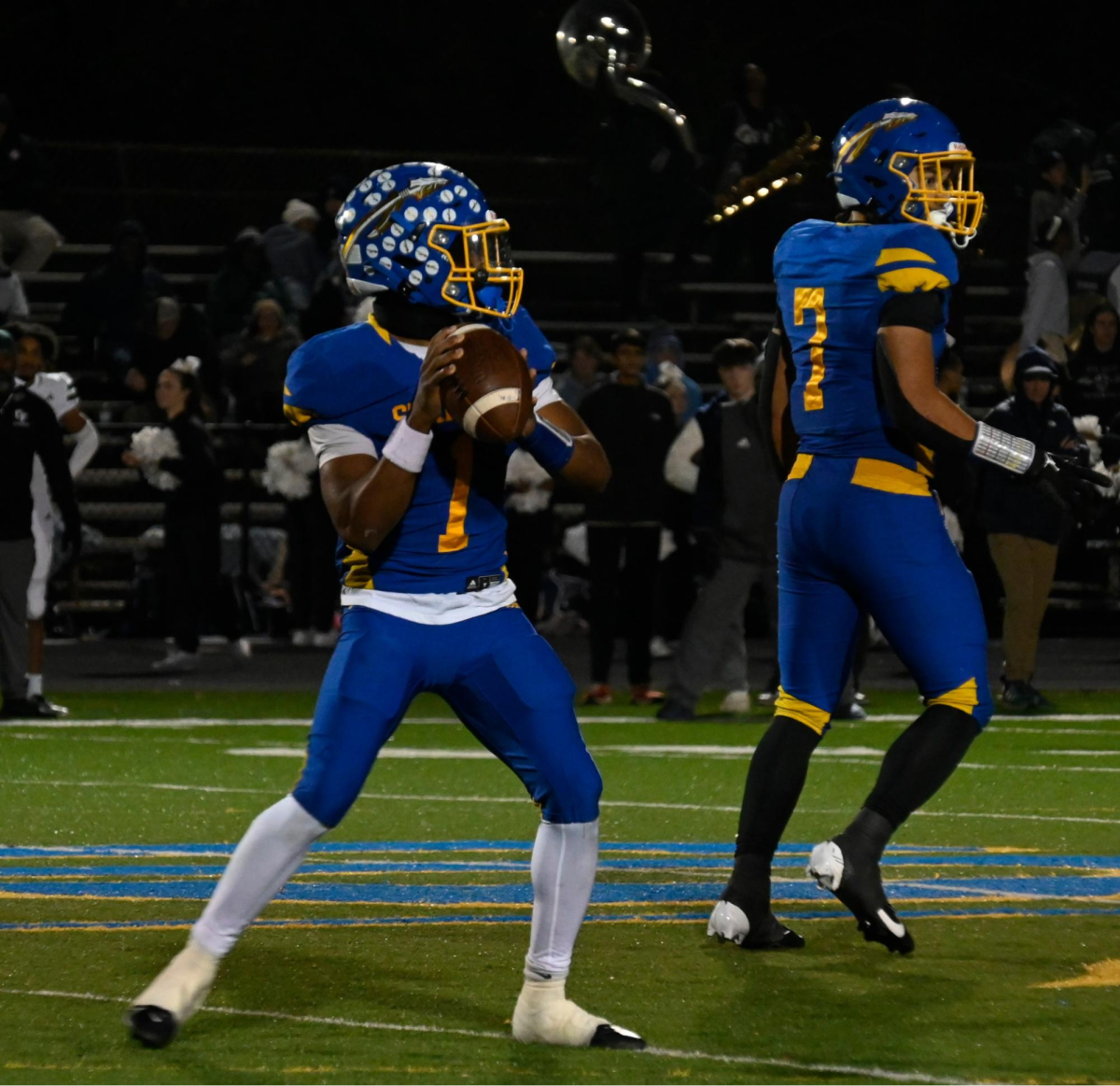 Quarterback Zion Grey drops back for a pass against Colonial Forge. In their first Regional playoff game since 2017.