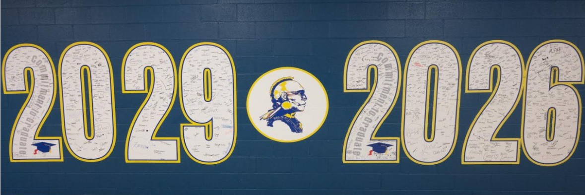 Signatures of SHS Seniors and Freshmen adorn the main hallway wall art. 