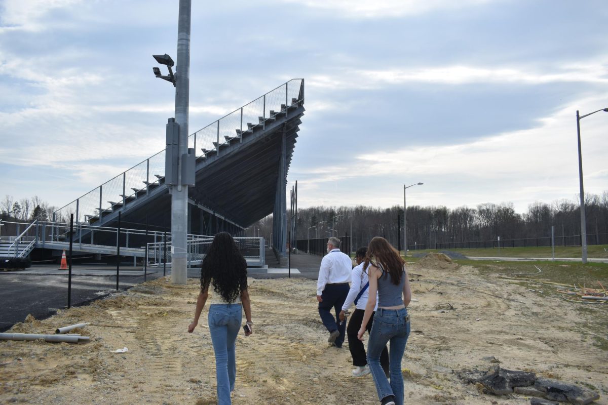 Jason Towery leading a media tour to the new football field at Hartwood High.
