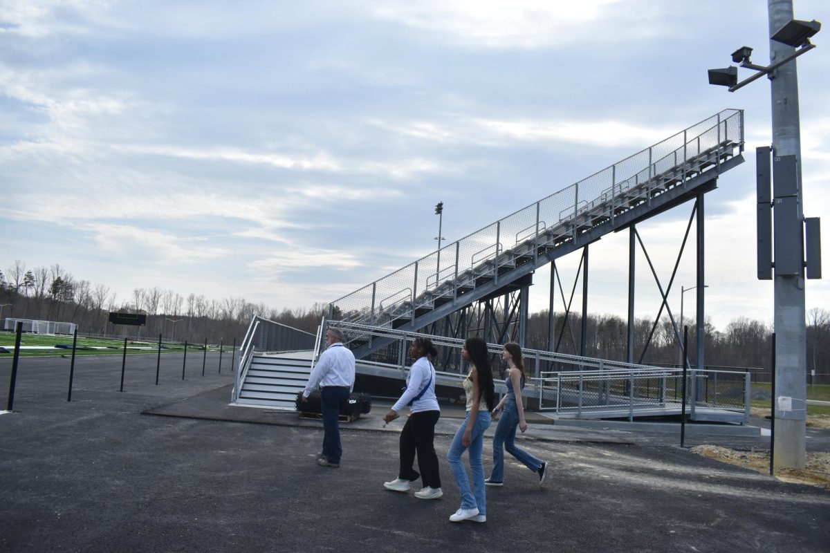 Jason Towery leading a media tour to the new football field at Hartwood High.