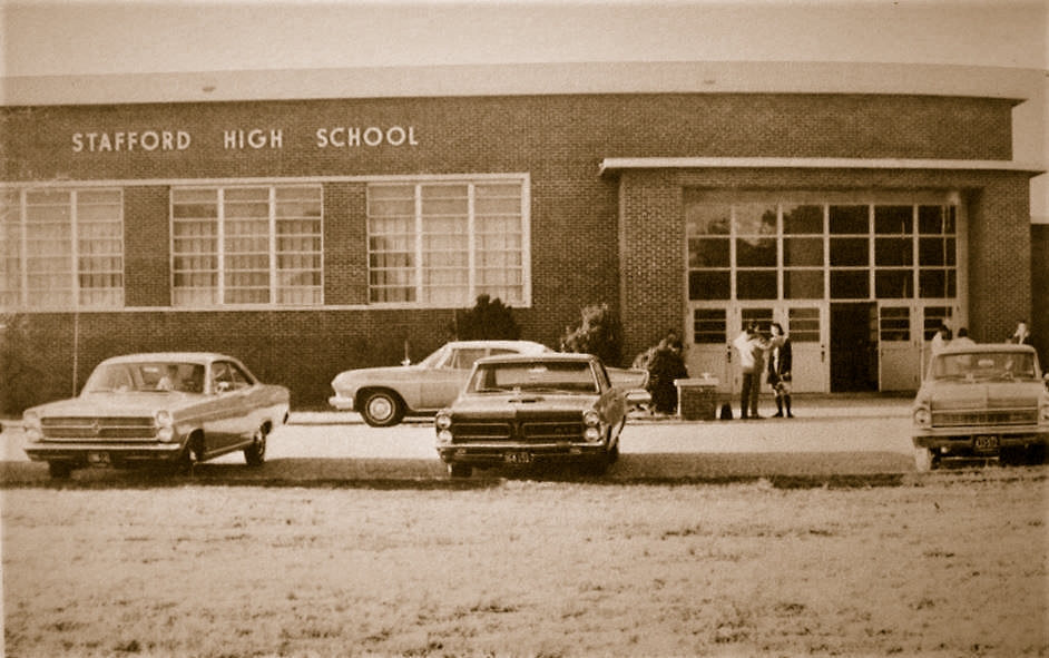 A photo from 1963 shows the facade of an earlier Stafford High School. 