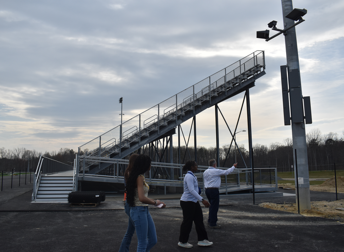 The new bleachers at Hartwood High School serve as a backdrop for a media tour led by Jason Towery, Chief Facilities Officer for SCPS.