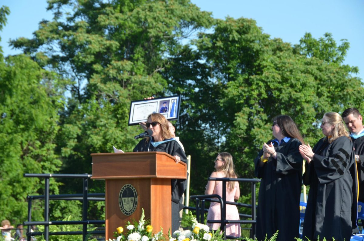 Parents of late Jaycob Hall accepting his posthumous diploma
